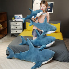OPHRBU blue shark plush for travel, comforting companion on car trips.