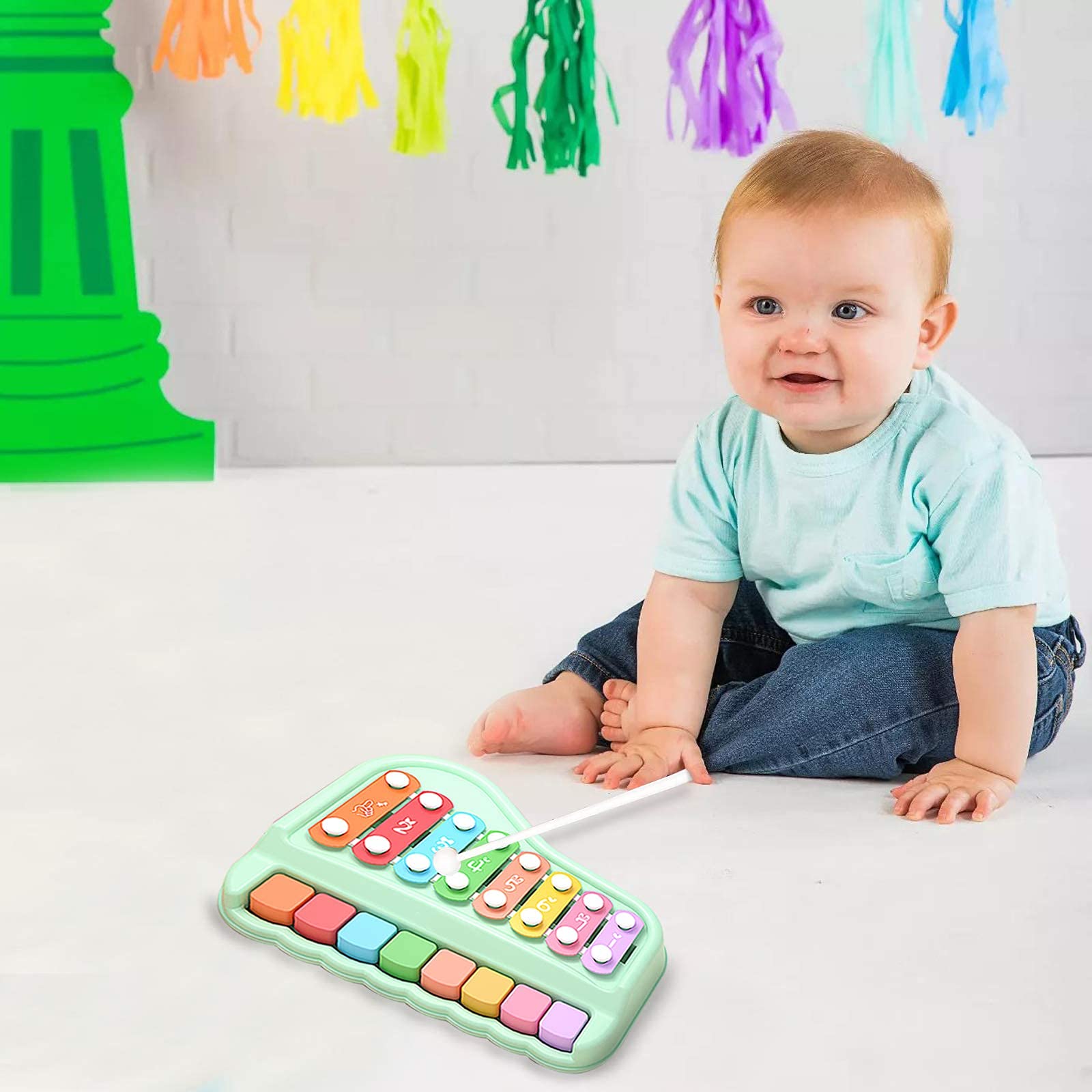 Oprala toddler music toy in use demonstrates hands-on learning through sound and rhythm.