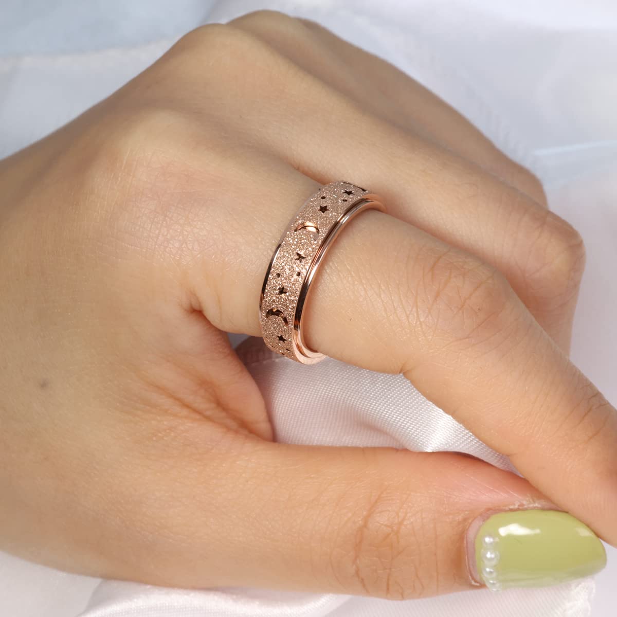 OreilleStar Anxiety Ring Spinner rainbow color offers discreet stress relief.
