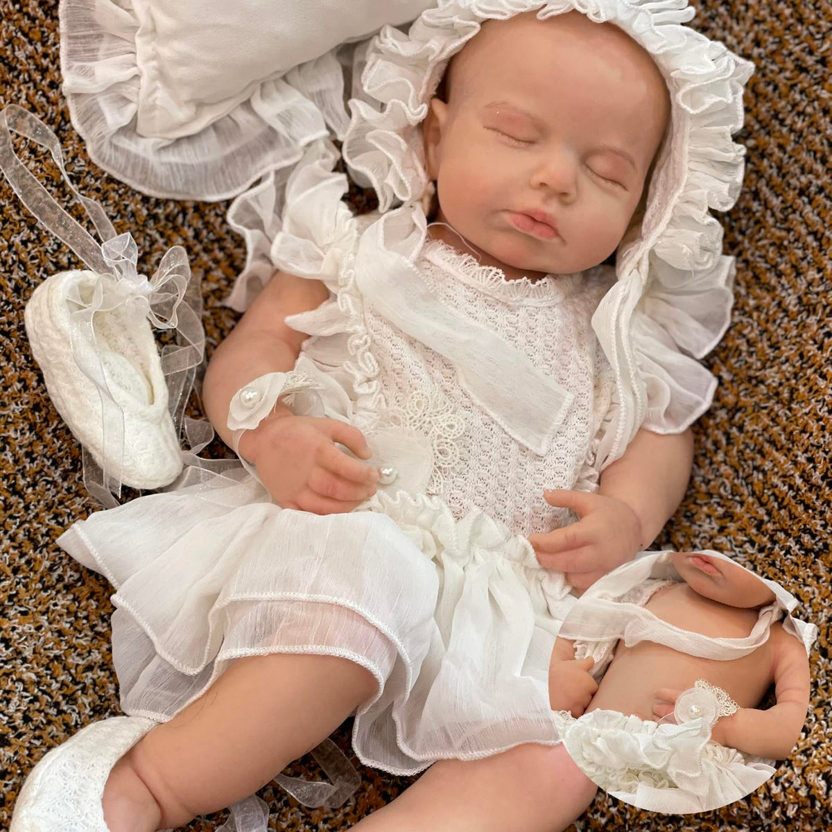 OtardDolls full-silicone reborn 18in for cuddling and dress-up play.
