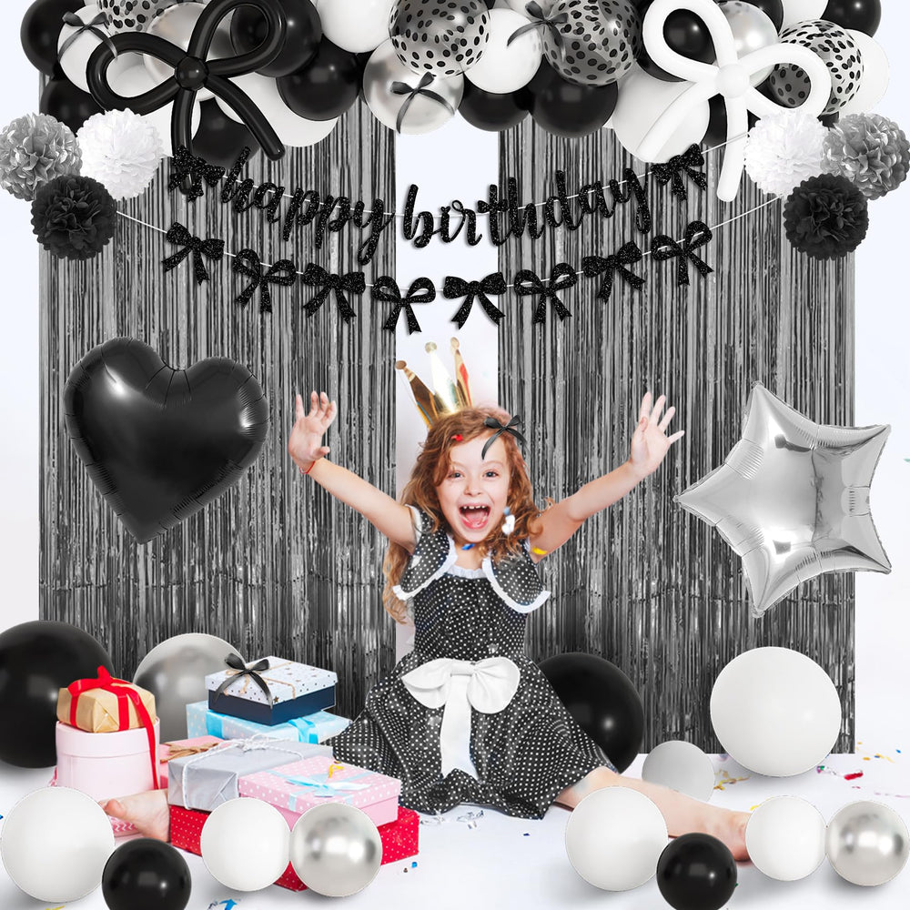 Ouddy Party black bow decor balloons coordinate a cohesive look.