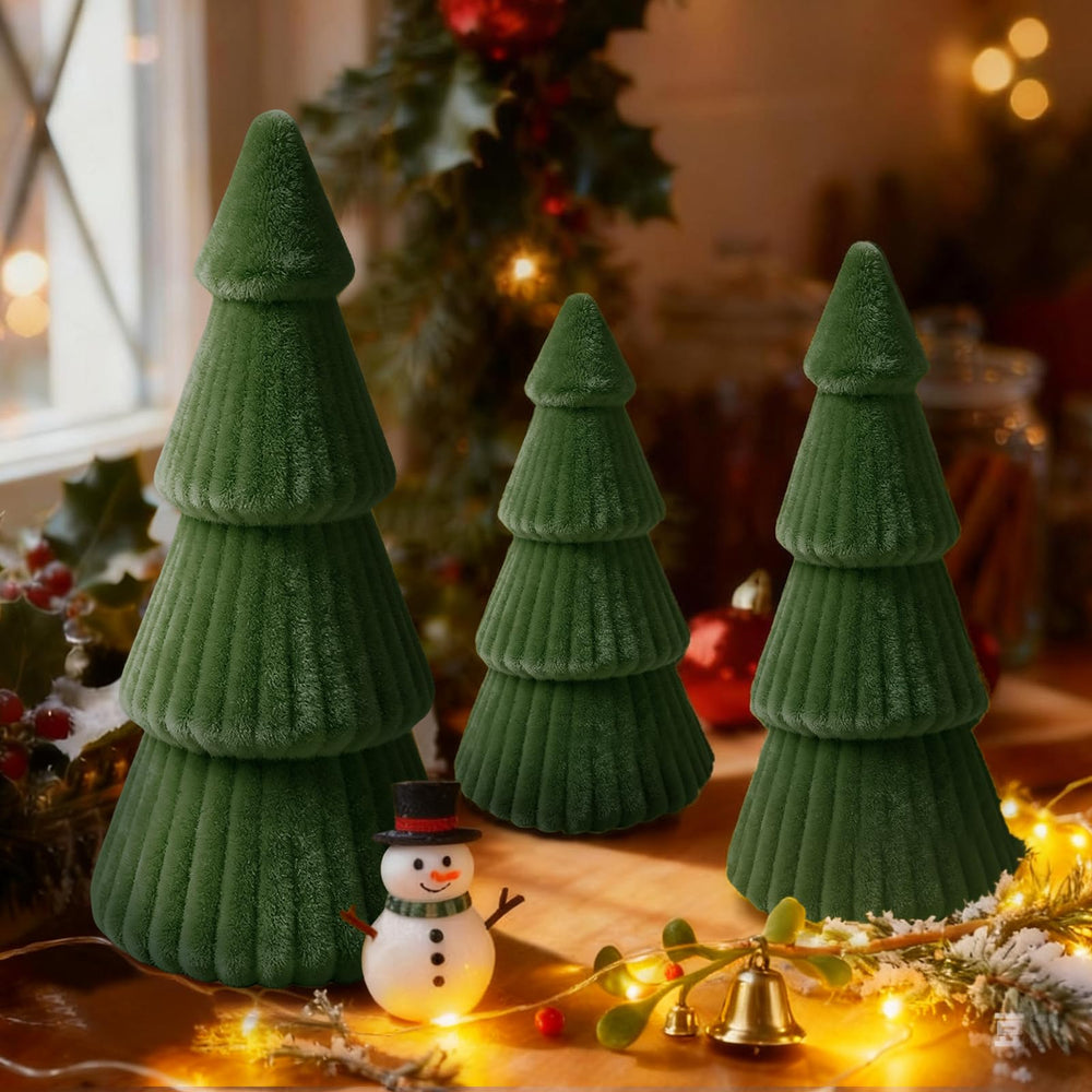 OuMuaMua Christmas trees with LED lights illuminate a shelf with warm ambiance.