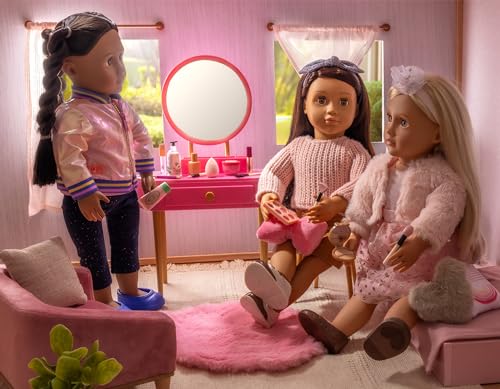 Our Generation pink vanity table mirror enhances pretend makeup sessions.