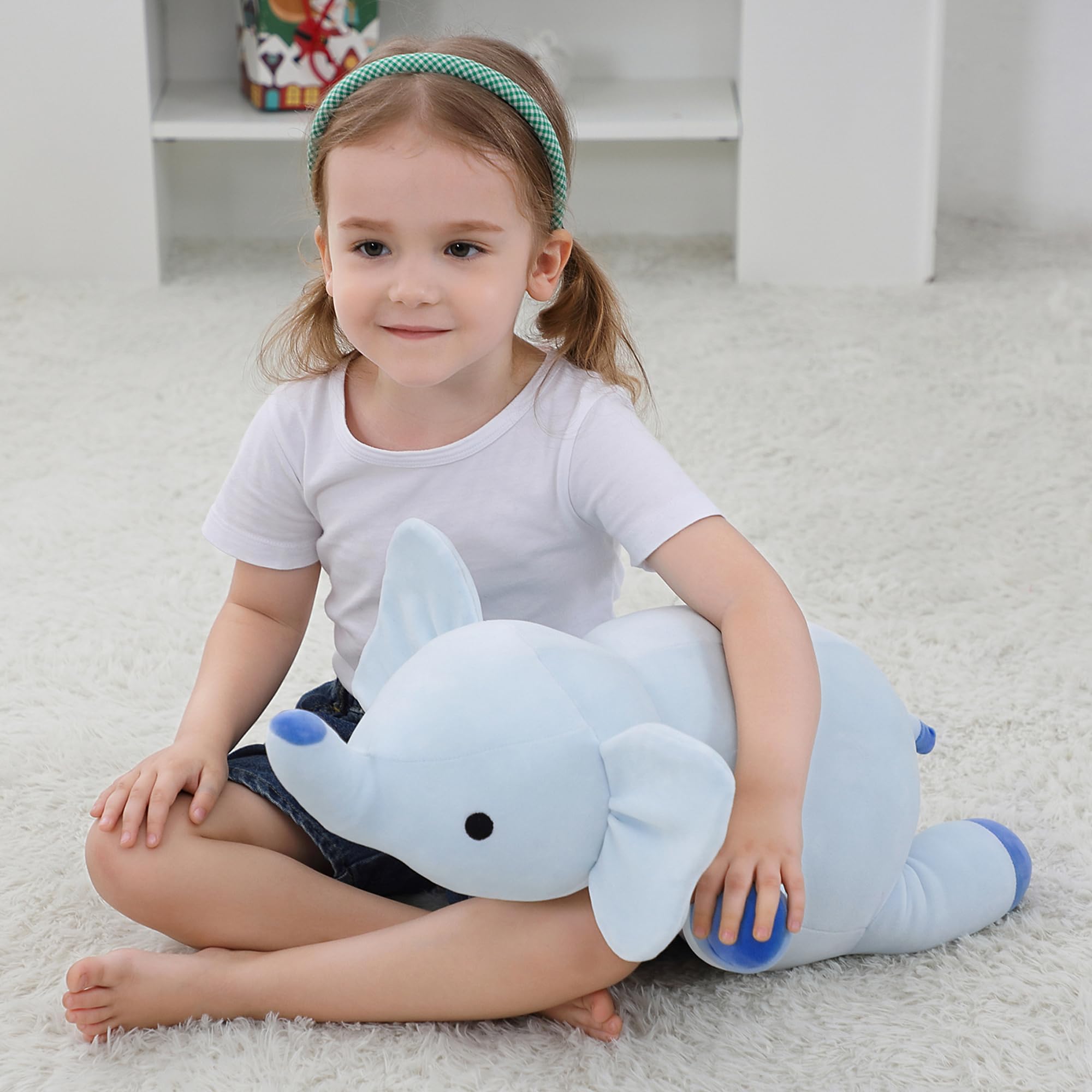OurHonor weighted elephant plush on a sofa adds warm decor and charm.