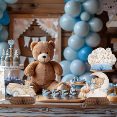 Outego bear-themed party table with photo-friendly backdrop