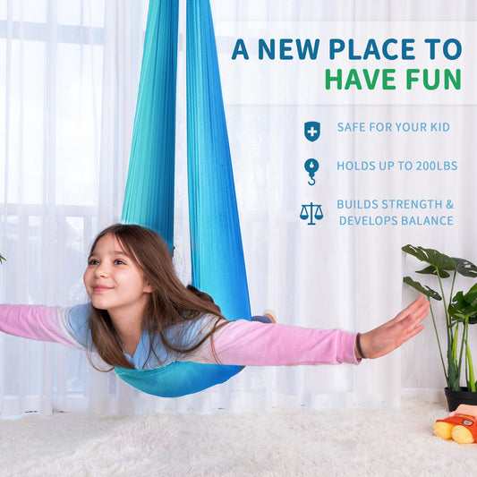 Outree sensory swing for kids being used in a cozy playroom