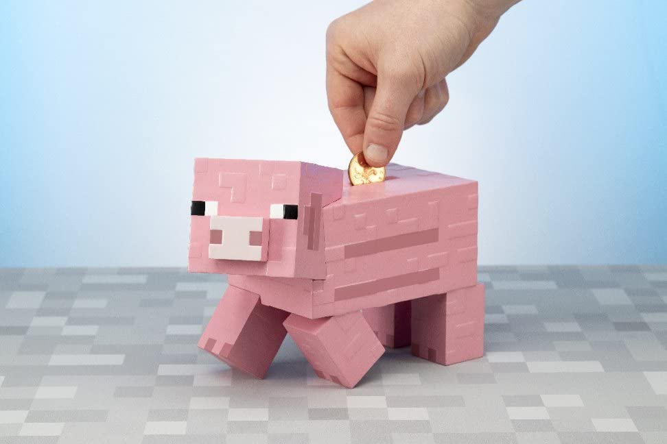 Pink Minecraft pig bank showing pixelated look, perfect for fans.