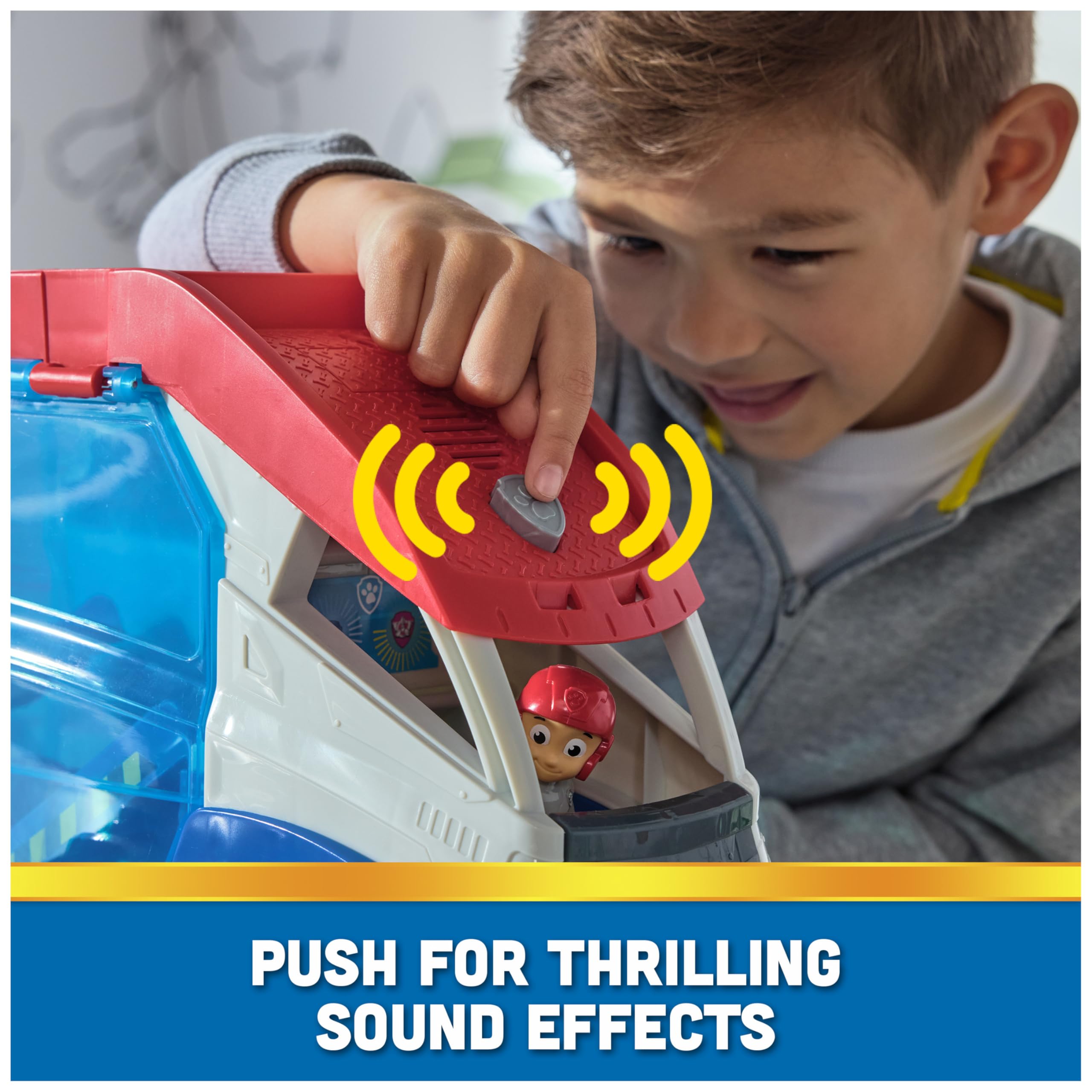 Roof button triggers show-inspired sound effects for immersive play.