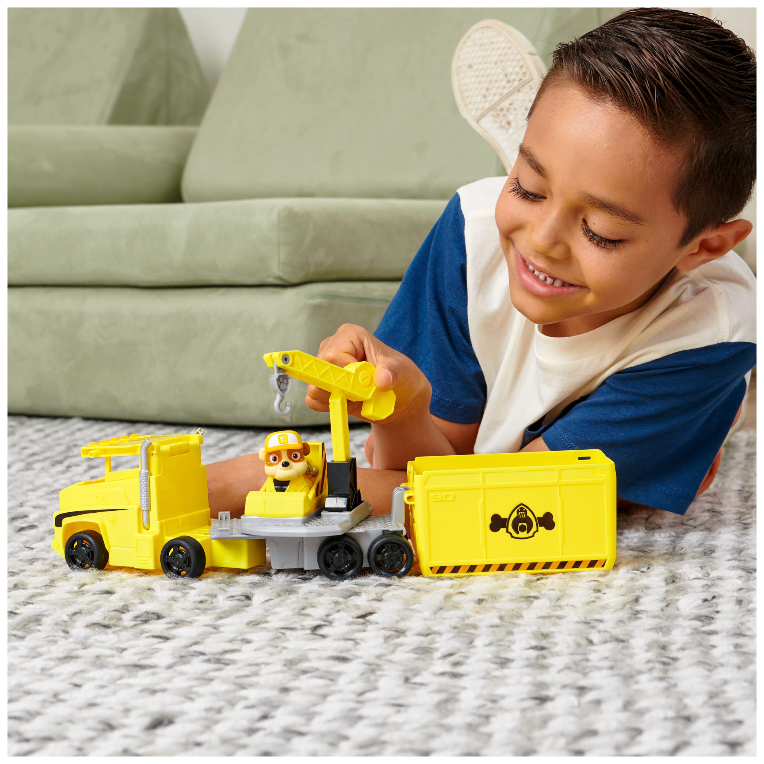 Paw Patrol Rubble figure inside cab ready for highway rescue adventures.