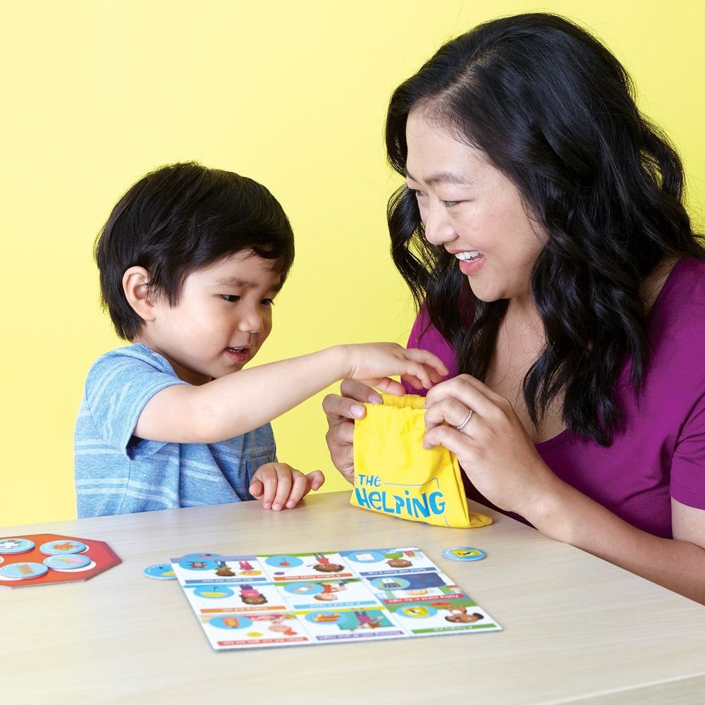 Peaceable Kingdom tokens and helping bag enabling collaborative problem solving