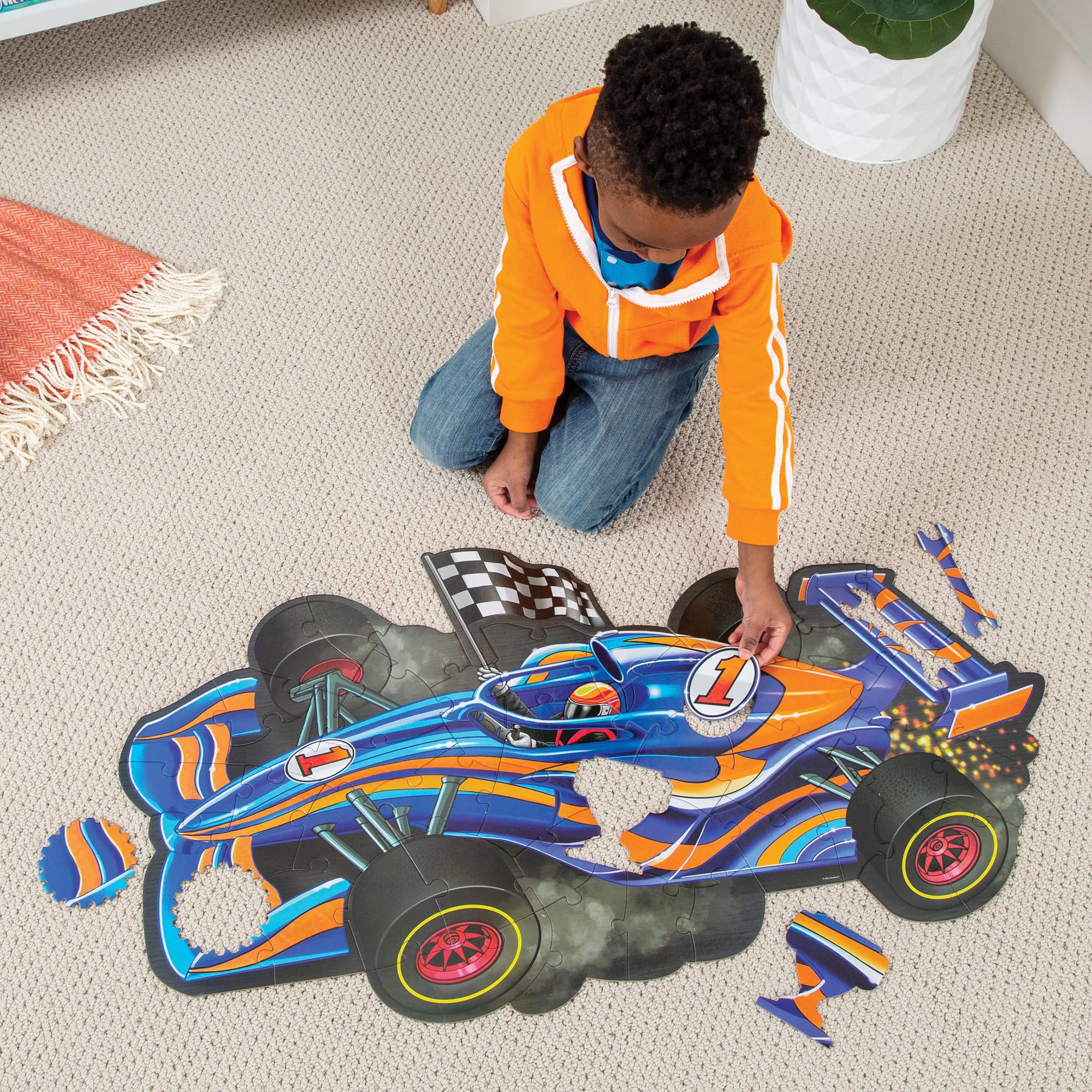 Peaceable Kingdom large, unique-shaped pieces invite exploration in a racecar puzzle.