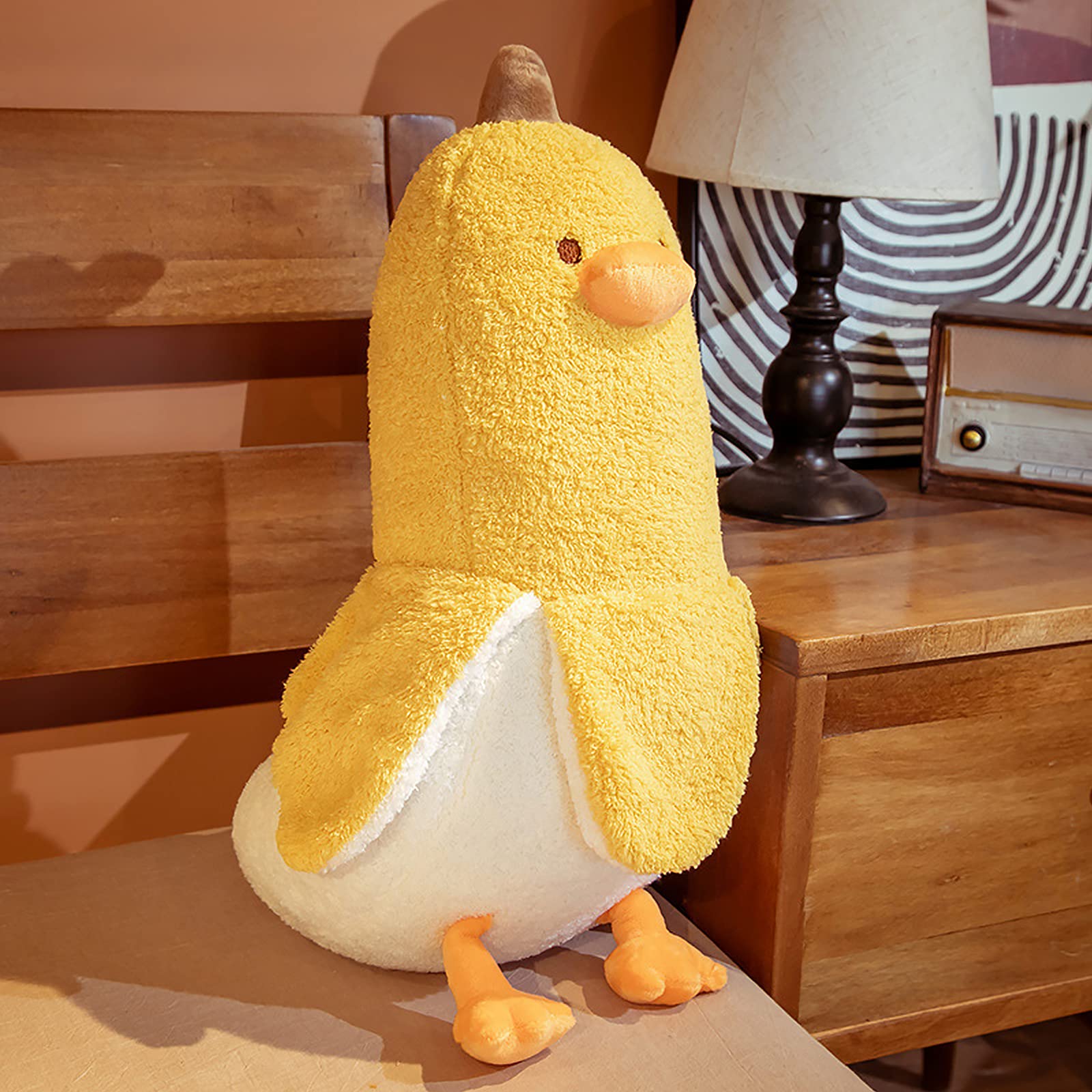 PEACH CAT Banana Duck plush by the bed for bedtime comfort.