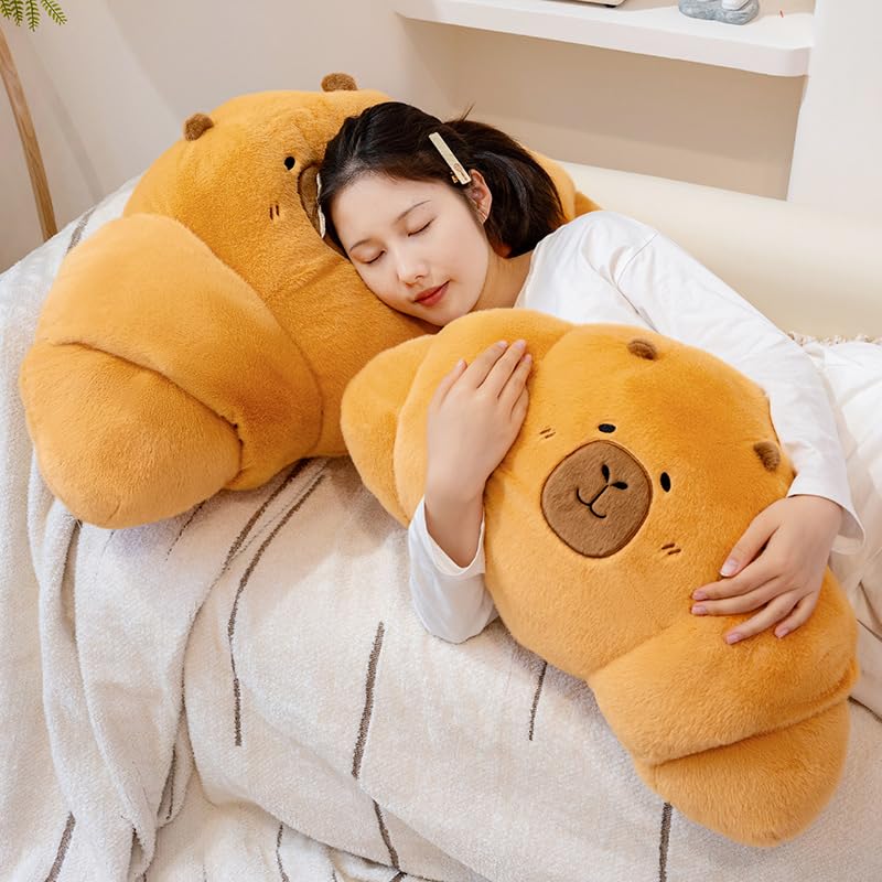 PEACH CAT croissant capybara plush, side view, ideal pillow for relaxing after school.