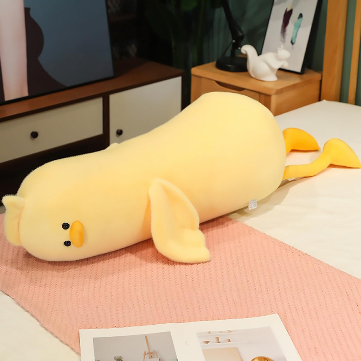Peach Cat Long Duck Plush Pillow full view, a cuddly companion for reading or relaxing