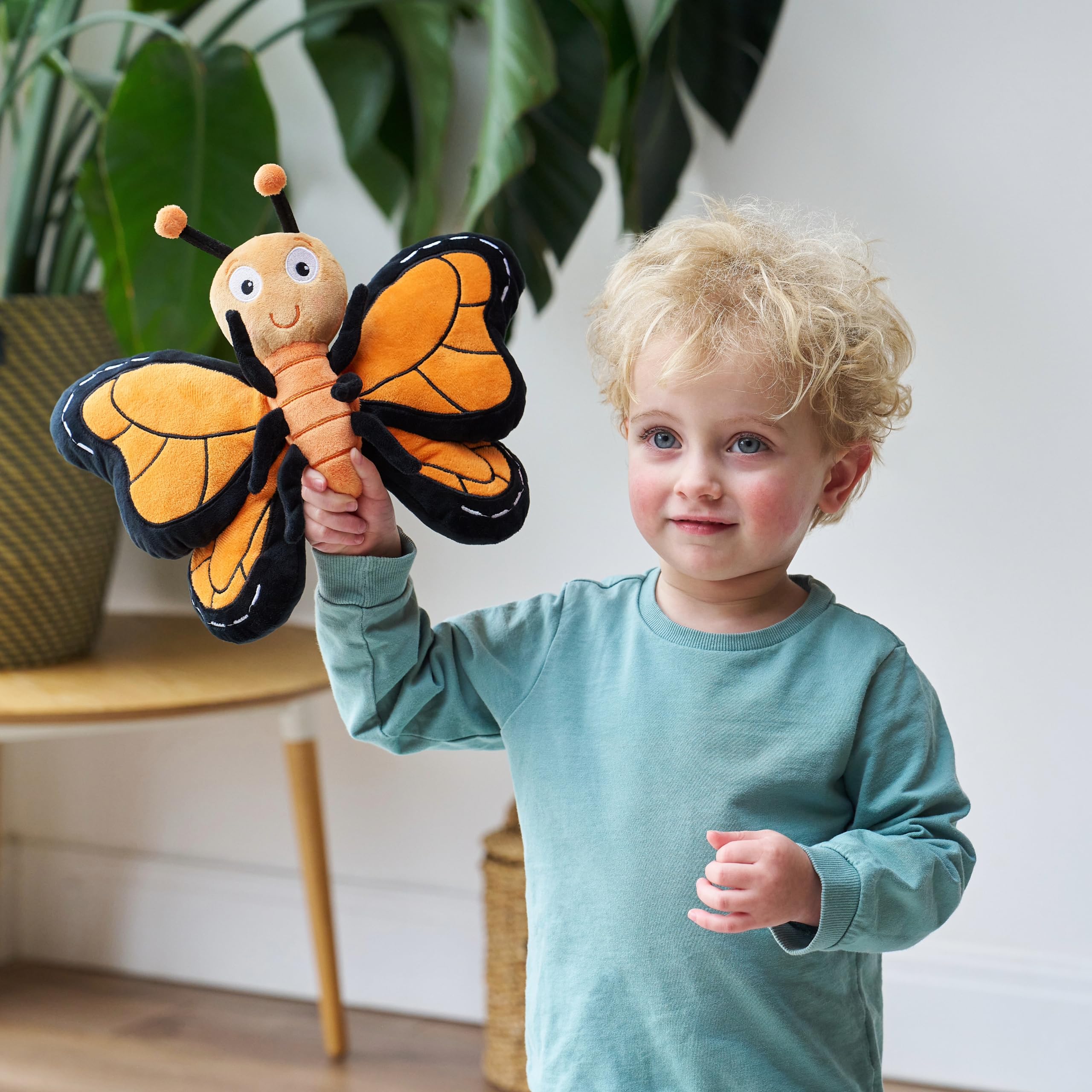 Pebbles butterfly textured wing patterns enhance tactile exploration during play.