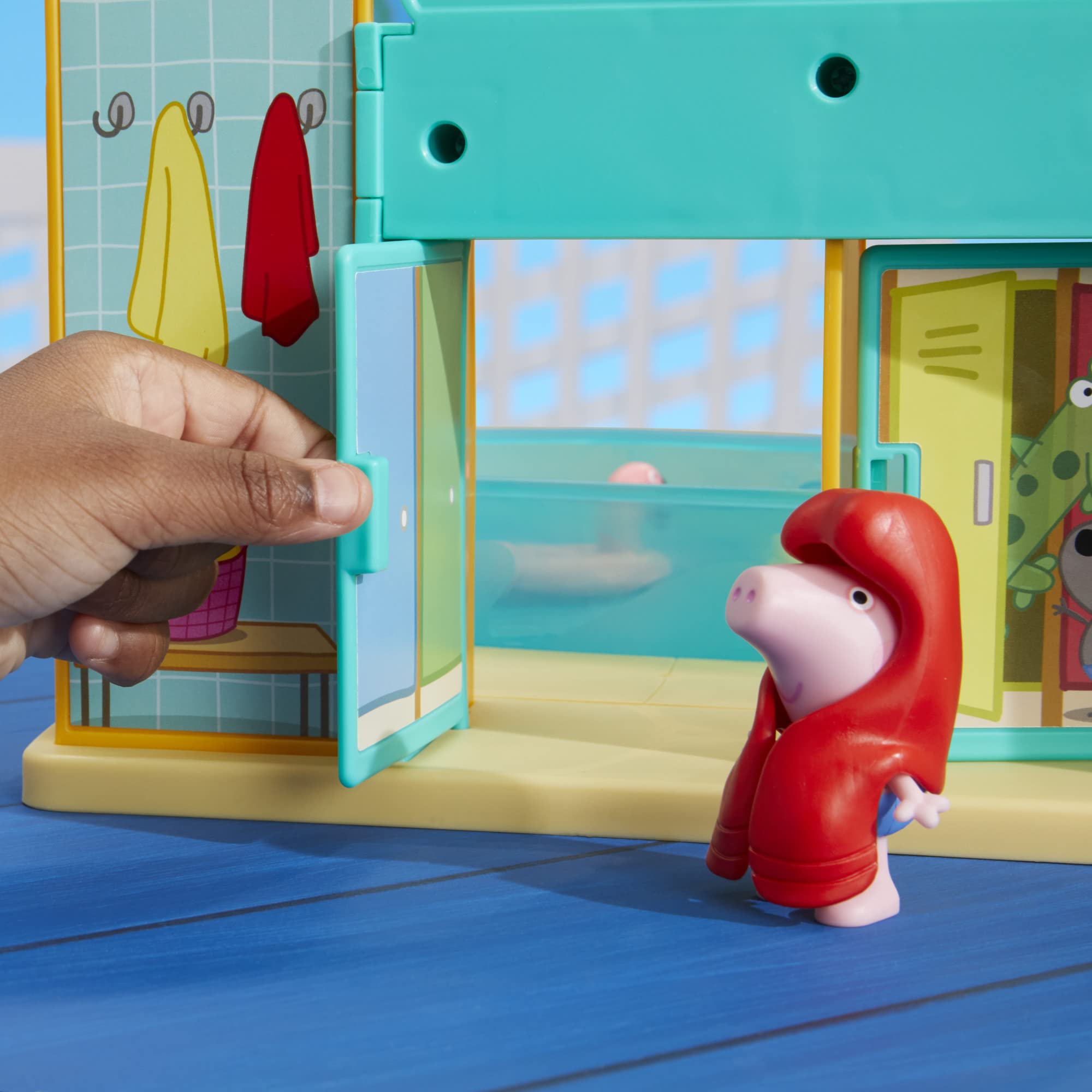 Peppa and George figures in bathing suits invite family-friendly play.