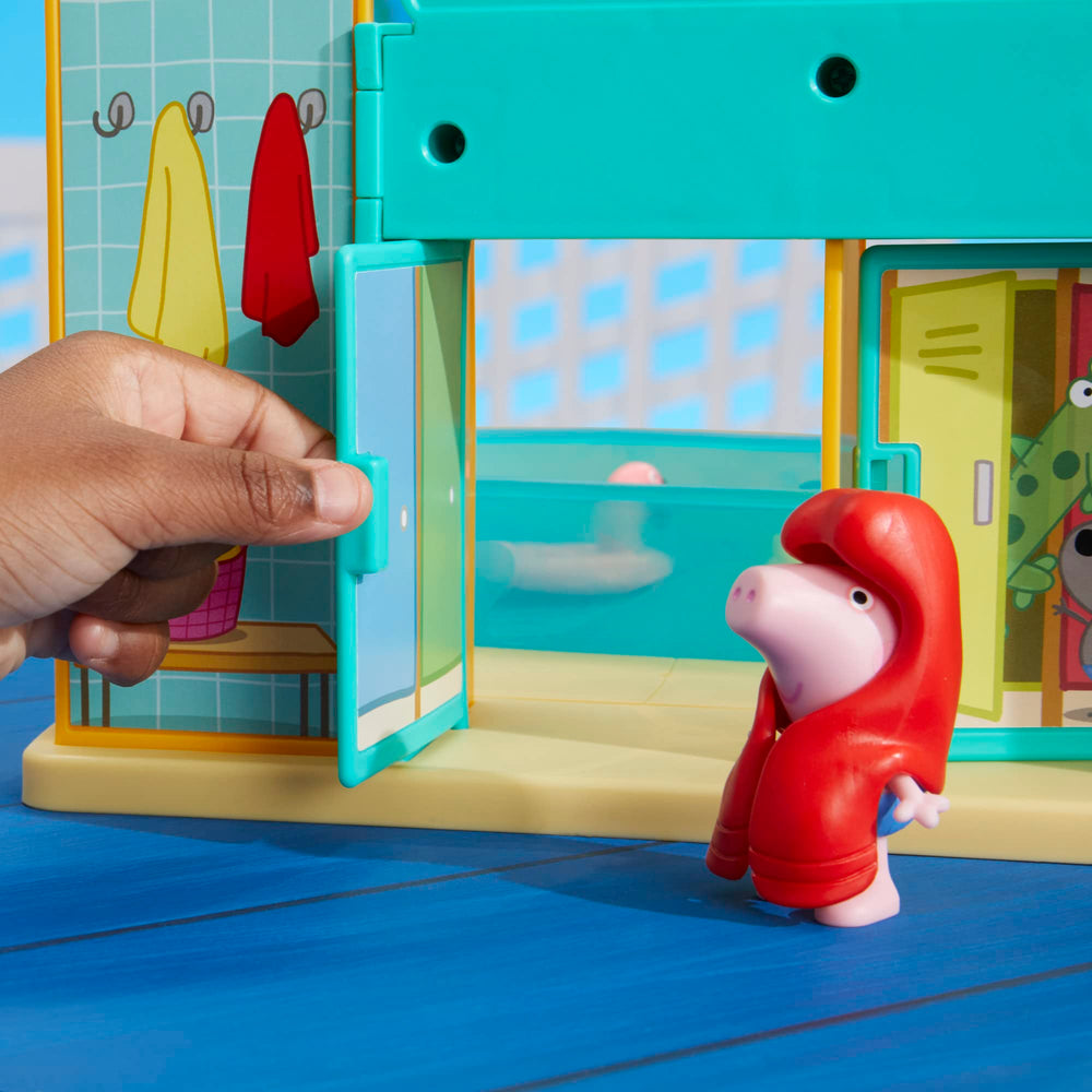 Peppa and George figures in bathing suits invite family-friendly play.