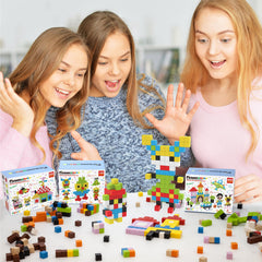 Children use PicassoTiles cubes in hands-on stacking and imaginative construction.
