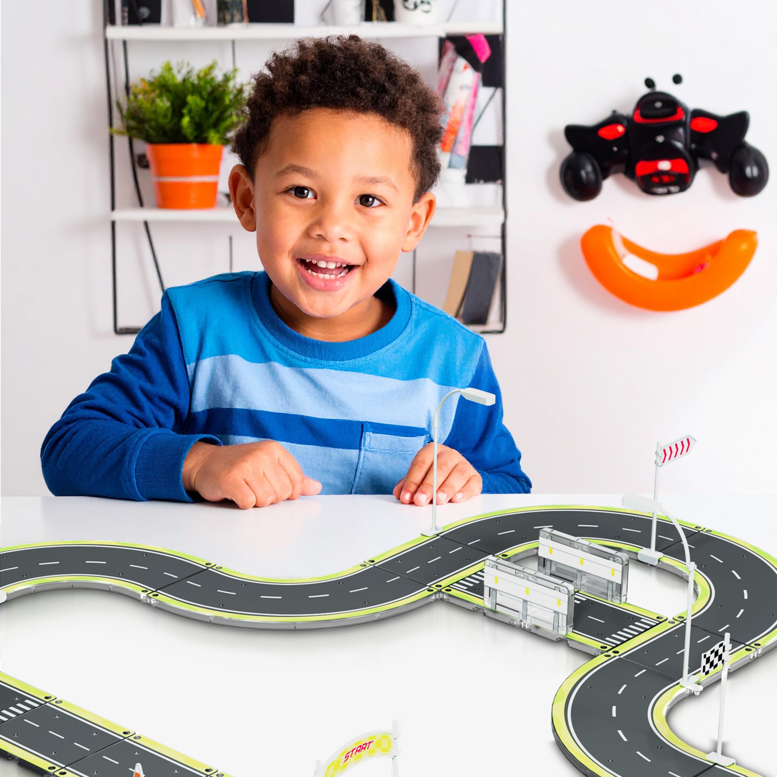 PicassoTiles road bumper barrier tiles help create safe, realistic race layouts for storytelling play.