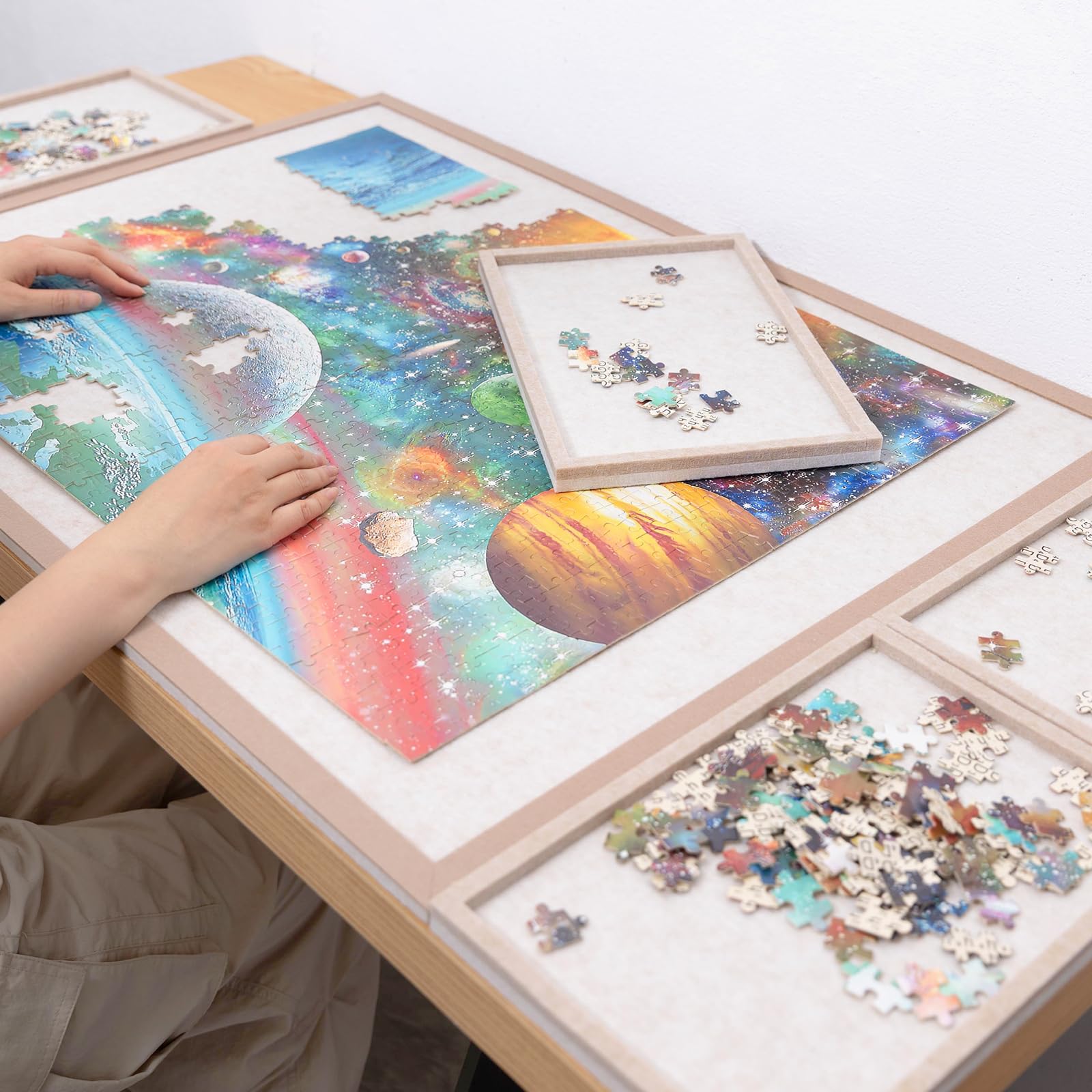 Piecevana puzzle board lip edge aids easy transfer of finished sections.
