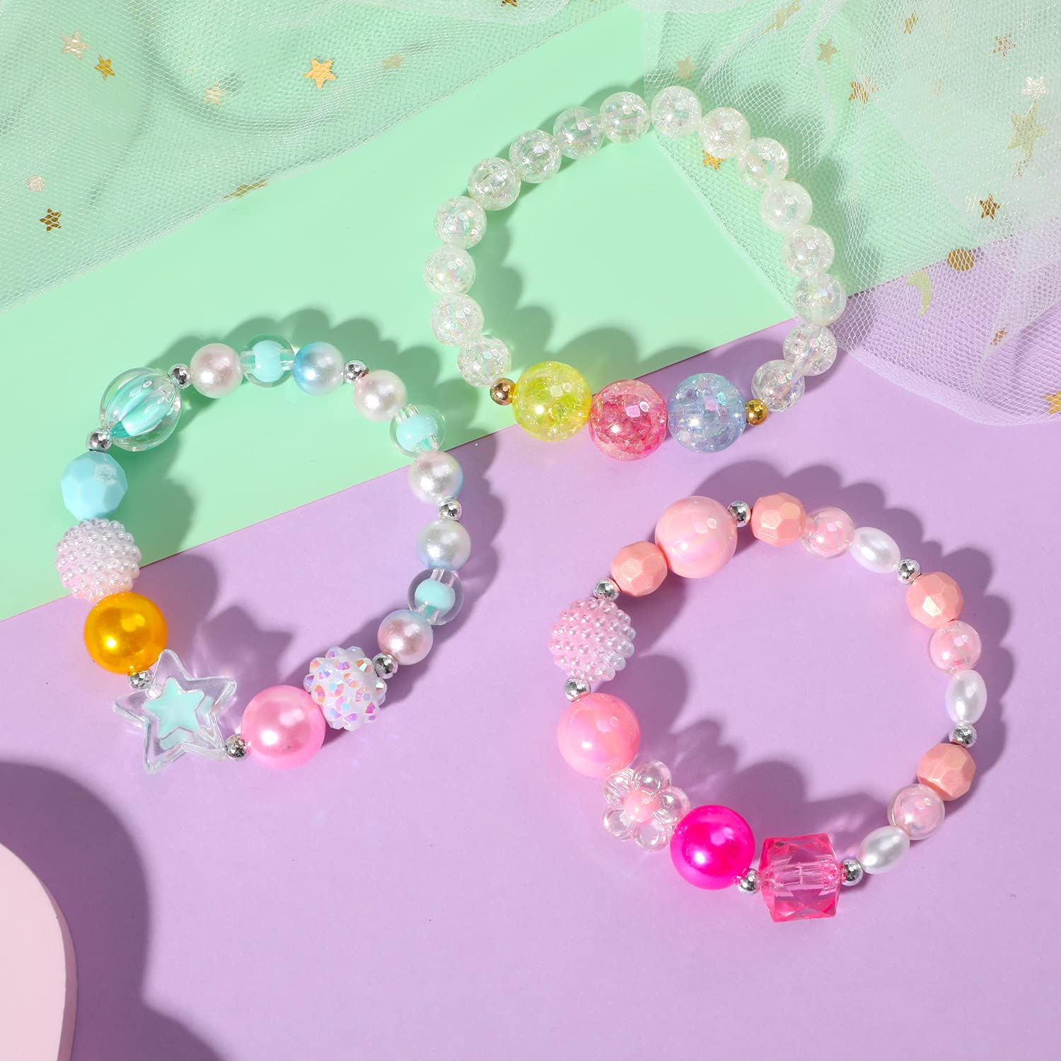 PinkSheep bracelet with rose-red heart pendant complements play attire.