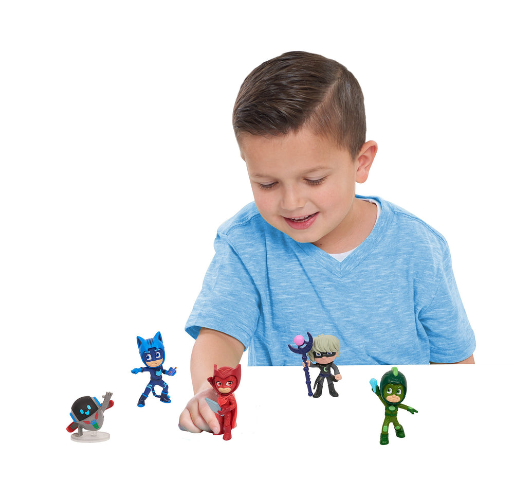 PJ Masks Gekko figure holding Moon Crystal for heroic adventures.