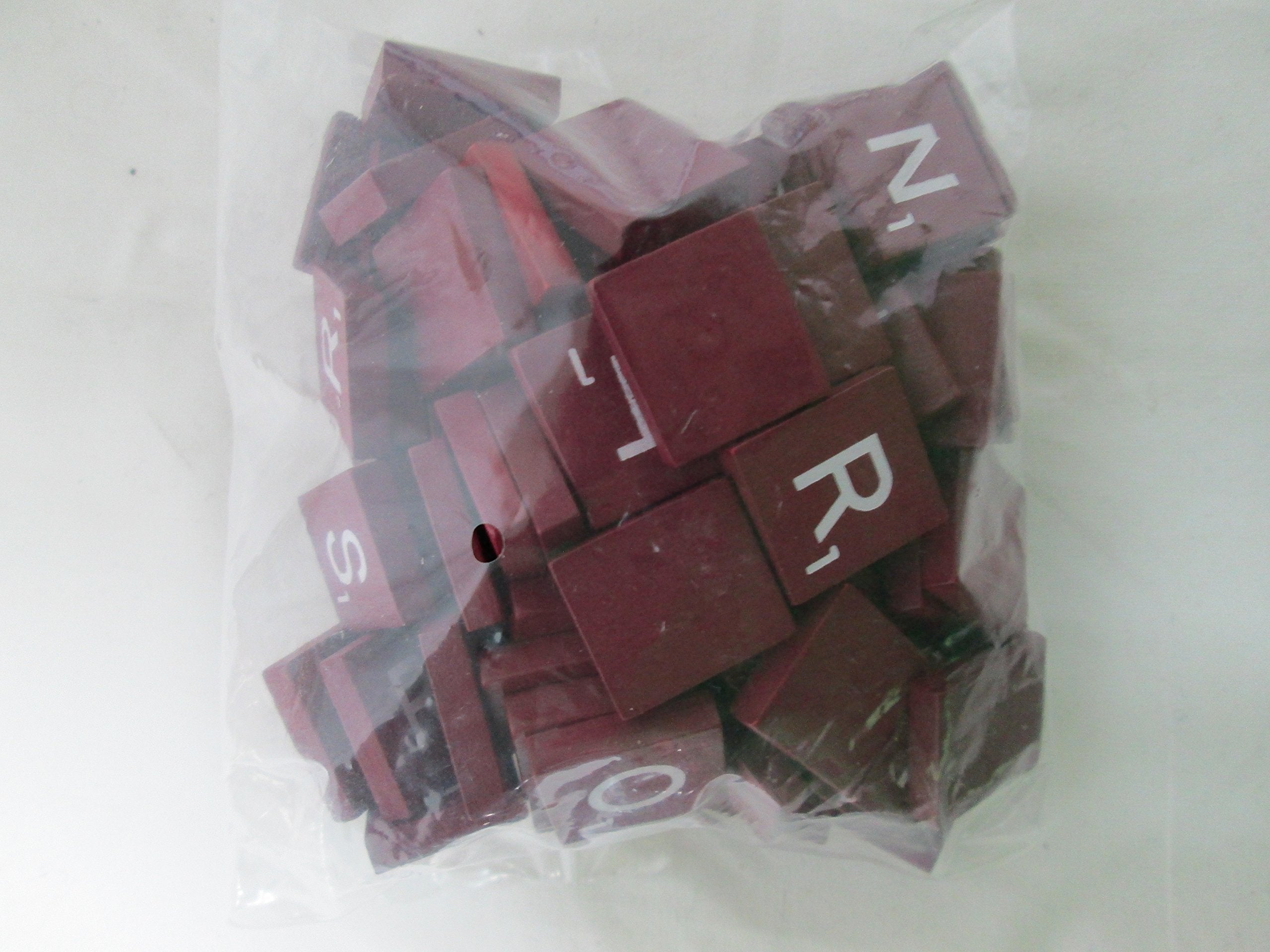 Planet Xpress maroon tiles with white letters, ideal for crafts and messages.