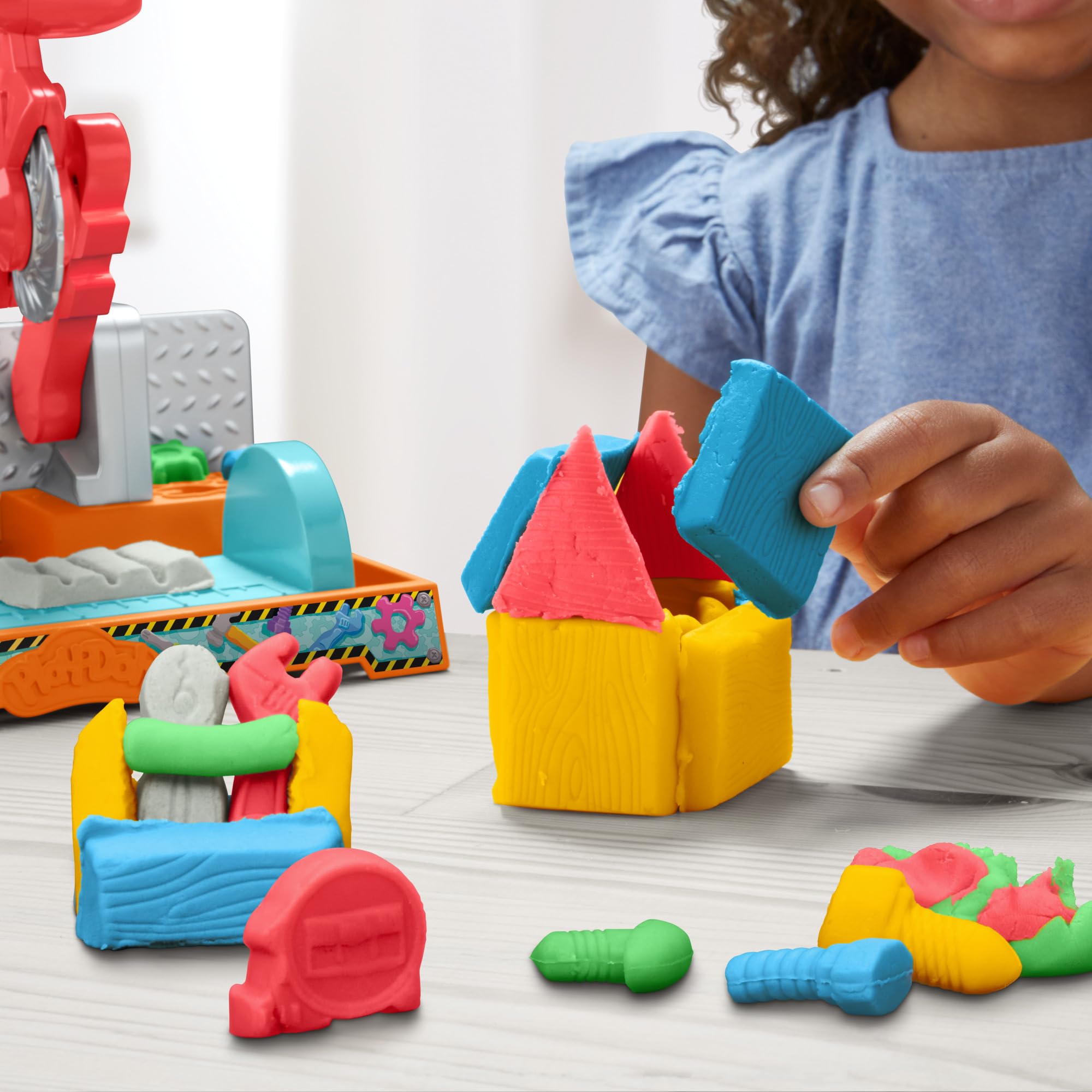 Play-Doh Stamp & Saw Tool Bench five color cans closeup for color exploration