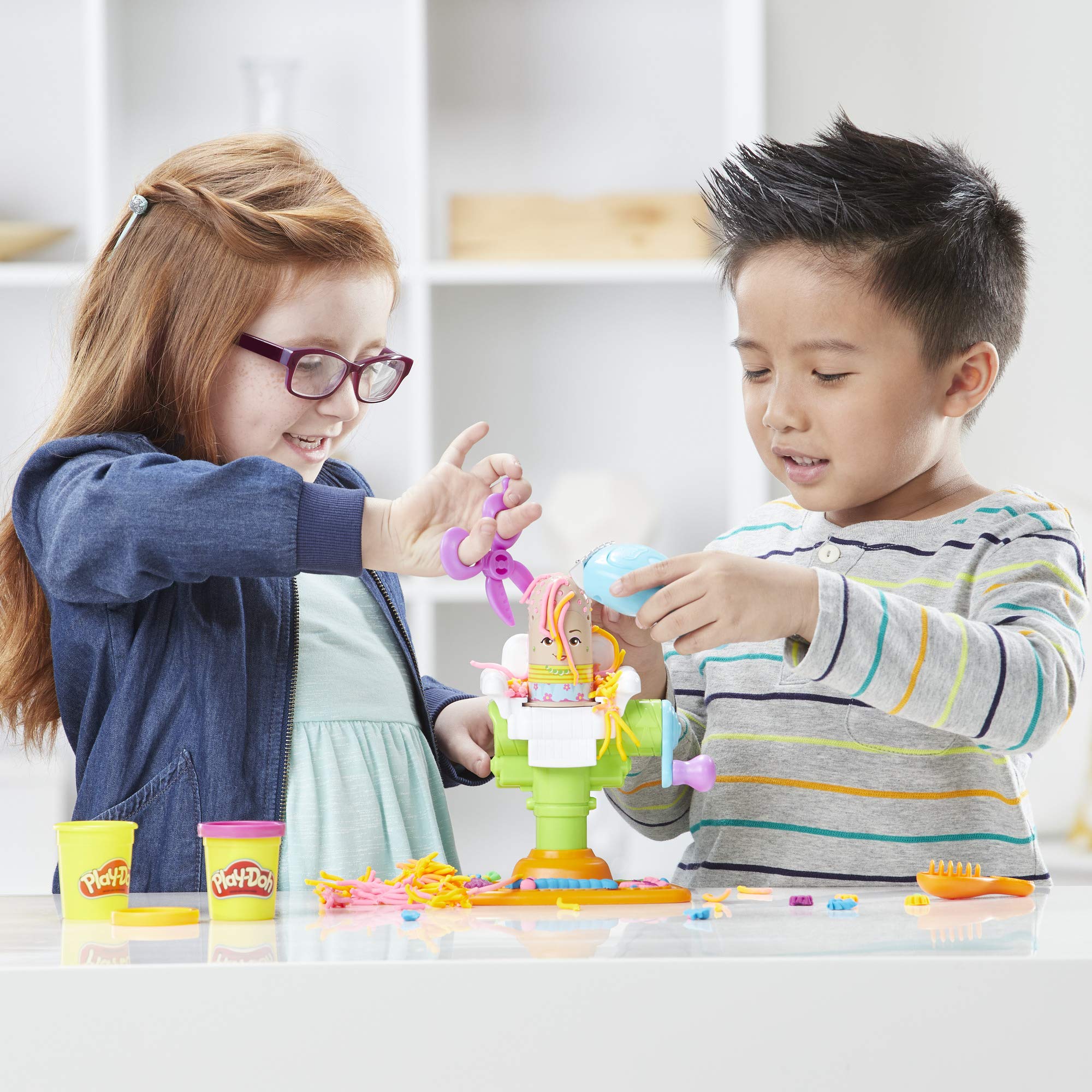 Kid-friendly scissors and razor in Play-Doh Buzz 'n Cut set.