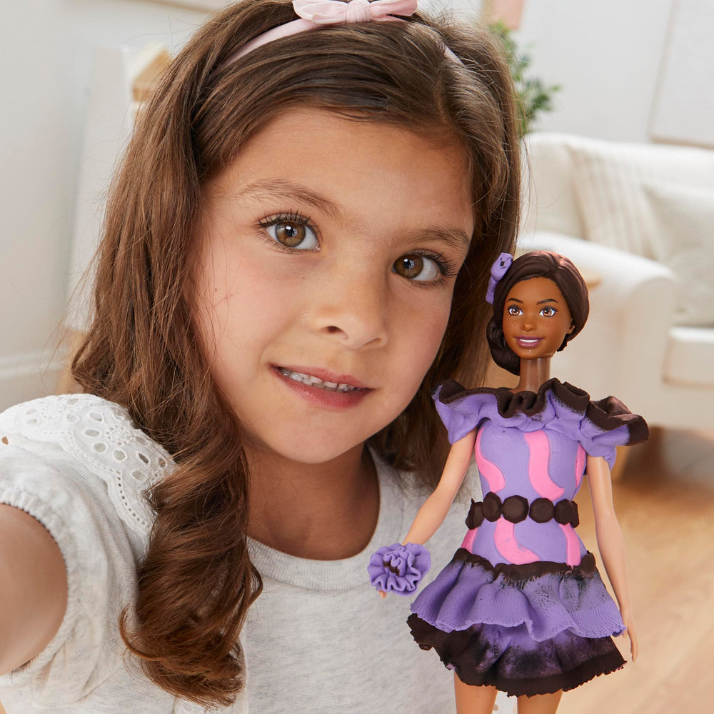 Dress-up stand helps kids swap Barbie outfits during playtime.