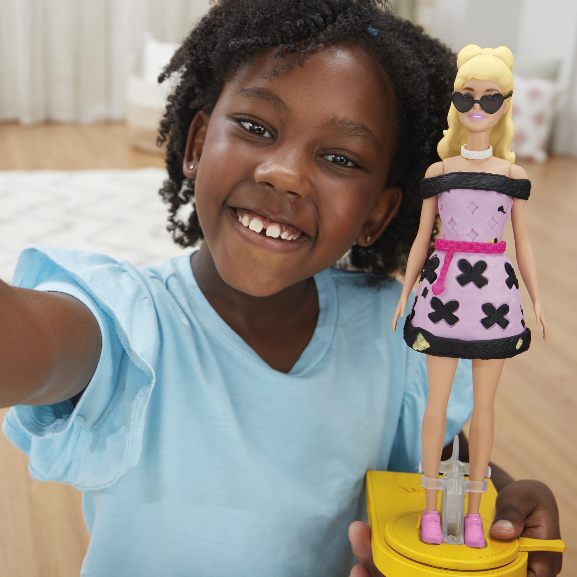 Play-Doh Barbie accessories like bows and shoes enhance final looks.
