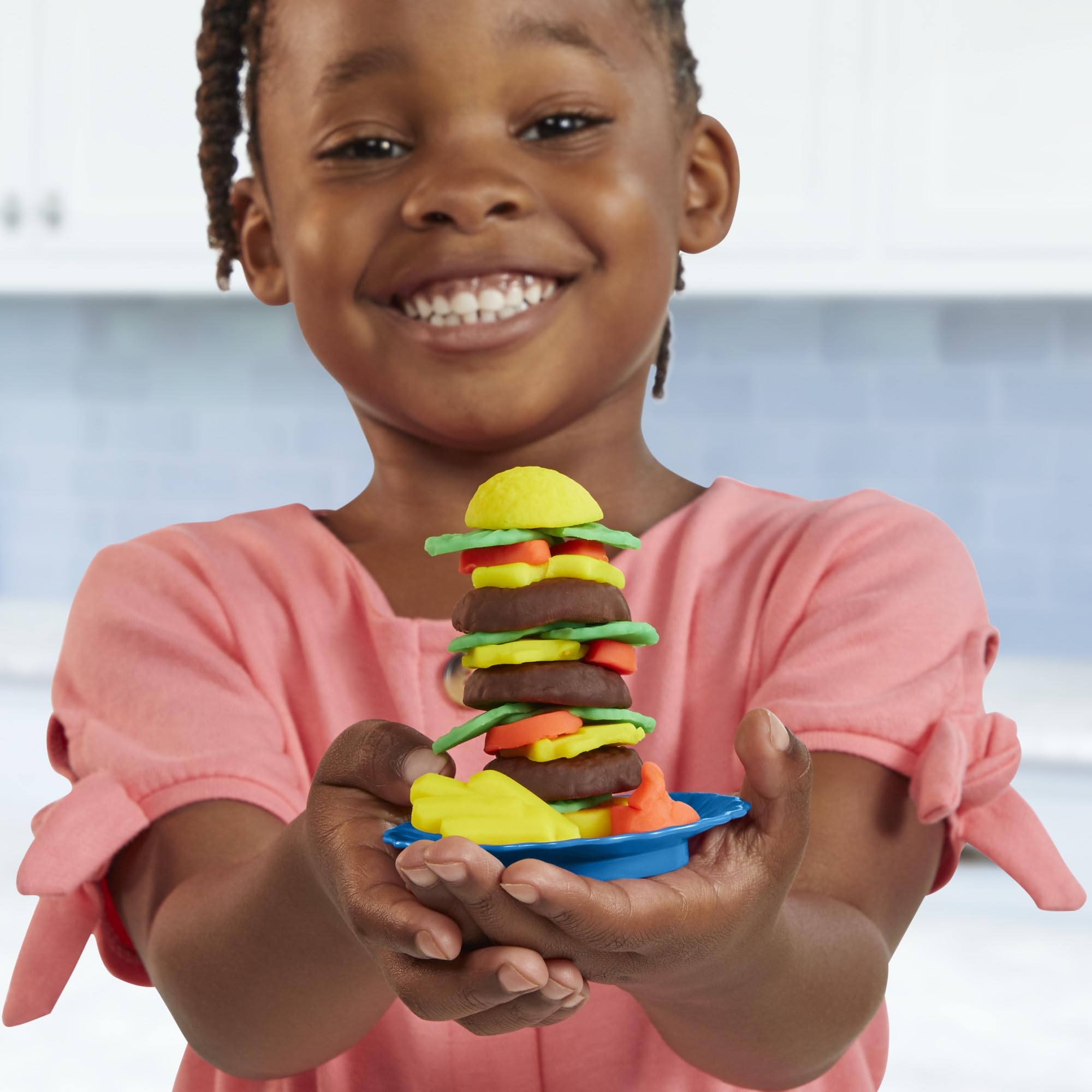 Play-Doh Kitchen Creations Busy Chef's Restaurant Playset includes desserts in the oven for pretend baking.