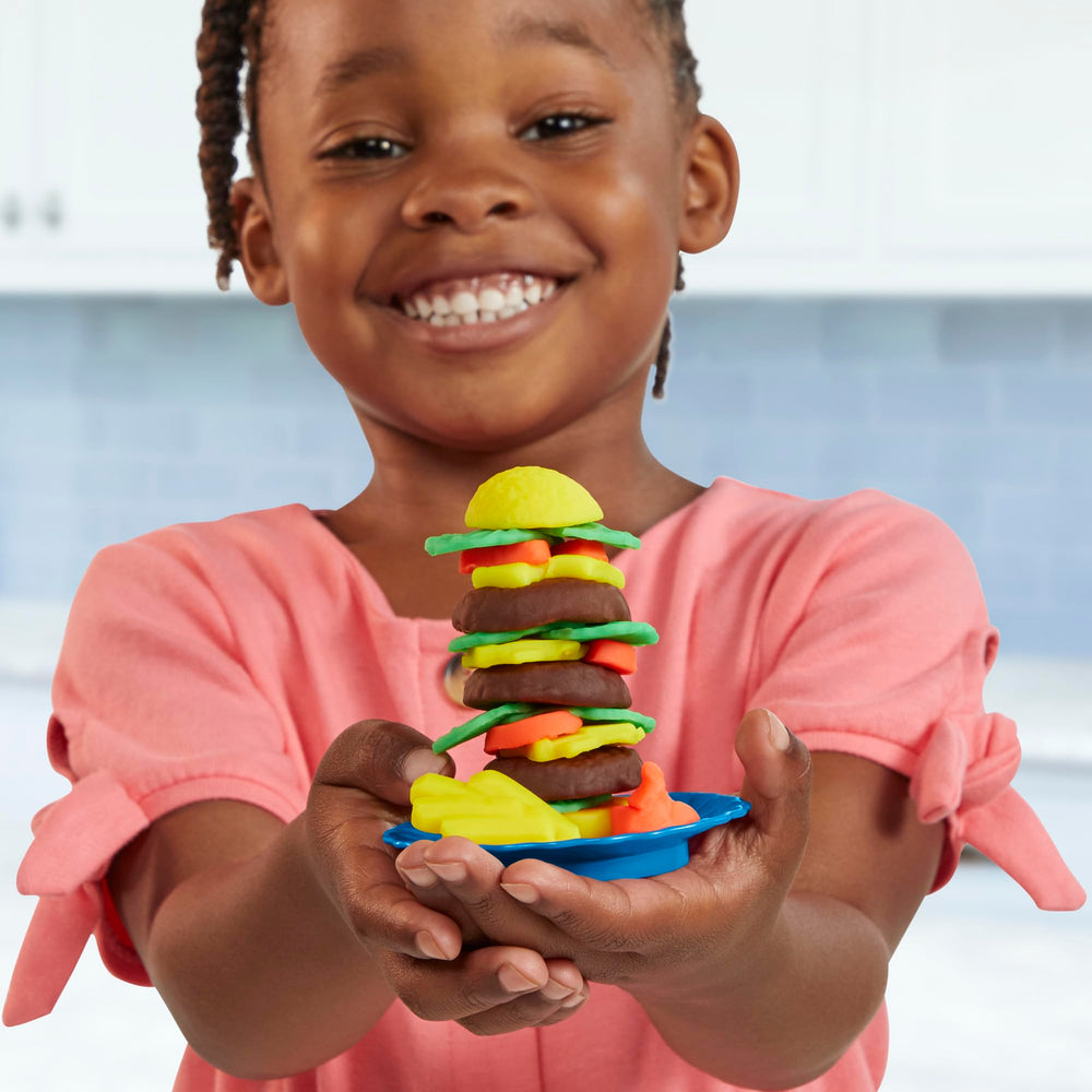 Play-Doh Kitchen Creations Busy Chef's Restaurant Playset includes desserts in the oven for pretend baking.