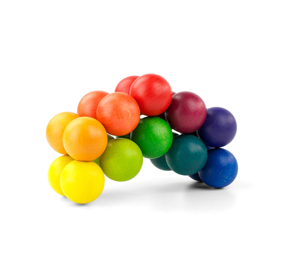 Playable Art Ball Rainbow 20 turned forms illustrate dynamic sculpture on a table.
