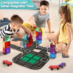 Close-up of Playmags road tiles showing magnets and glossy surface.