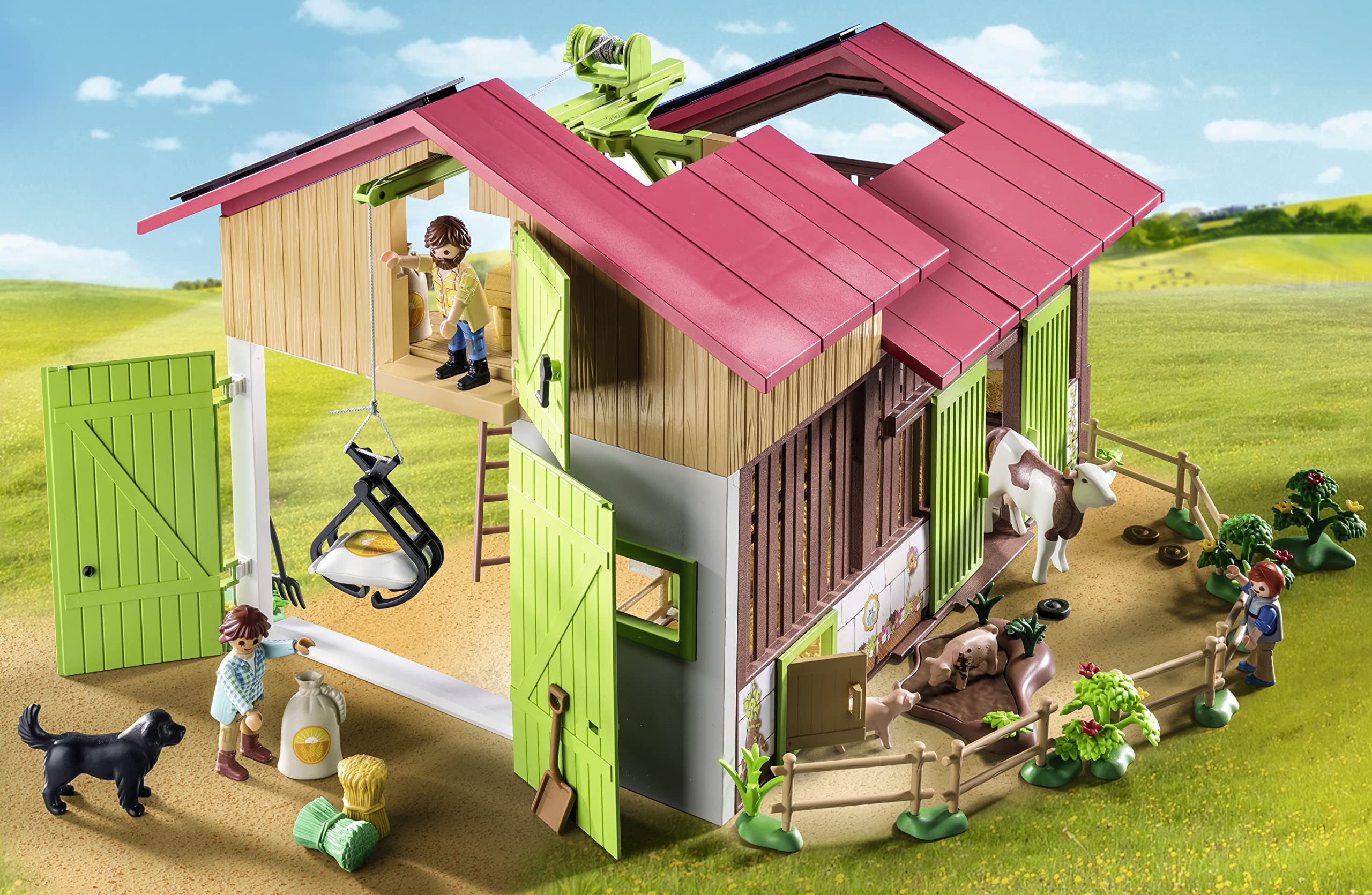 Playmobil Large Farm crane lifts hay bales for realistic farm logistics.