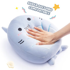 Playnics snug shark pillow supports reading or watching TV.