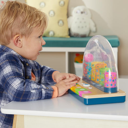 Playskool Little Wonders Pop-A-Tune ball pop action enhances cause-and-effect exploration.