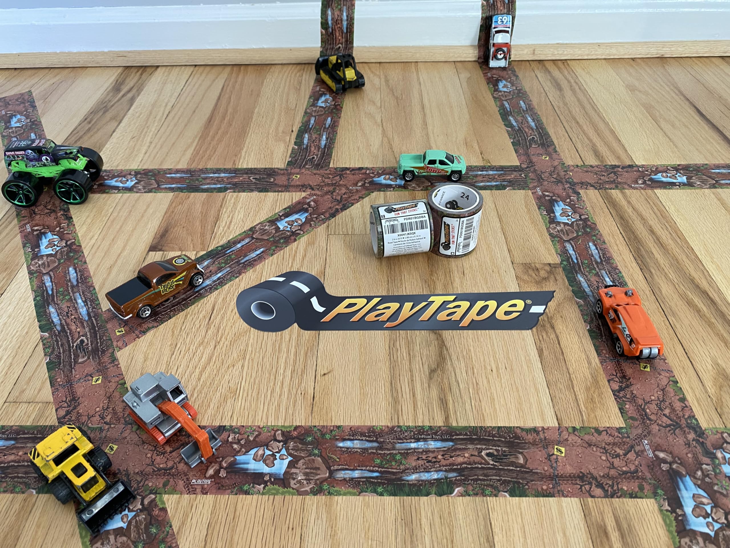 PlayTape Dirt Road unrolled on a table, inviting imaginative play