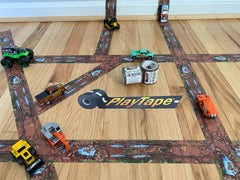 PlayTape Dirt Road unrolled on a table, inviting imaginative play