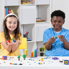 Plus Plus Build in Action kids building together for cooperative play.