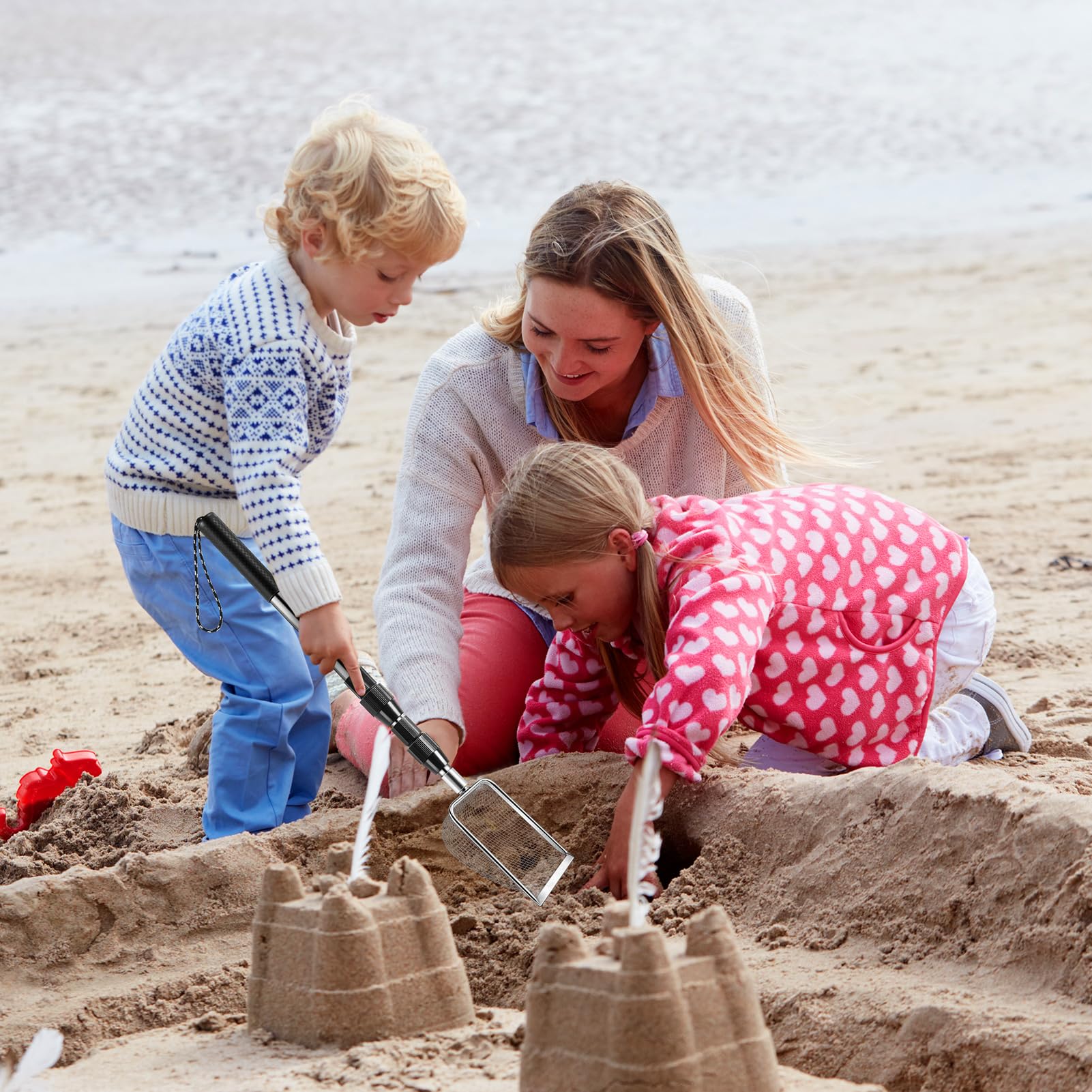 POILKMNI two-piece set includes durable handles and spares for family beach days.