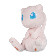 Pokémon Center Mew Sitting Cuties Plush sits upright on a desk for display.