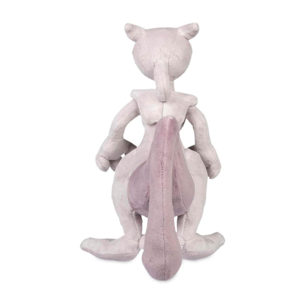 Pokemon Center Mewtwo plush on coffee table, adds collectible charm to living spaces.