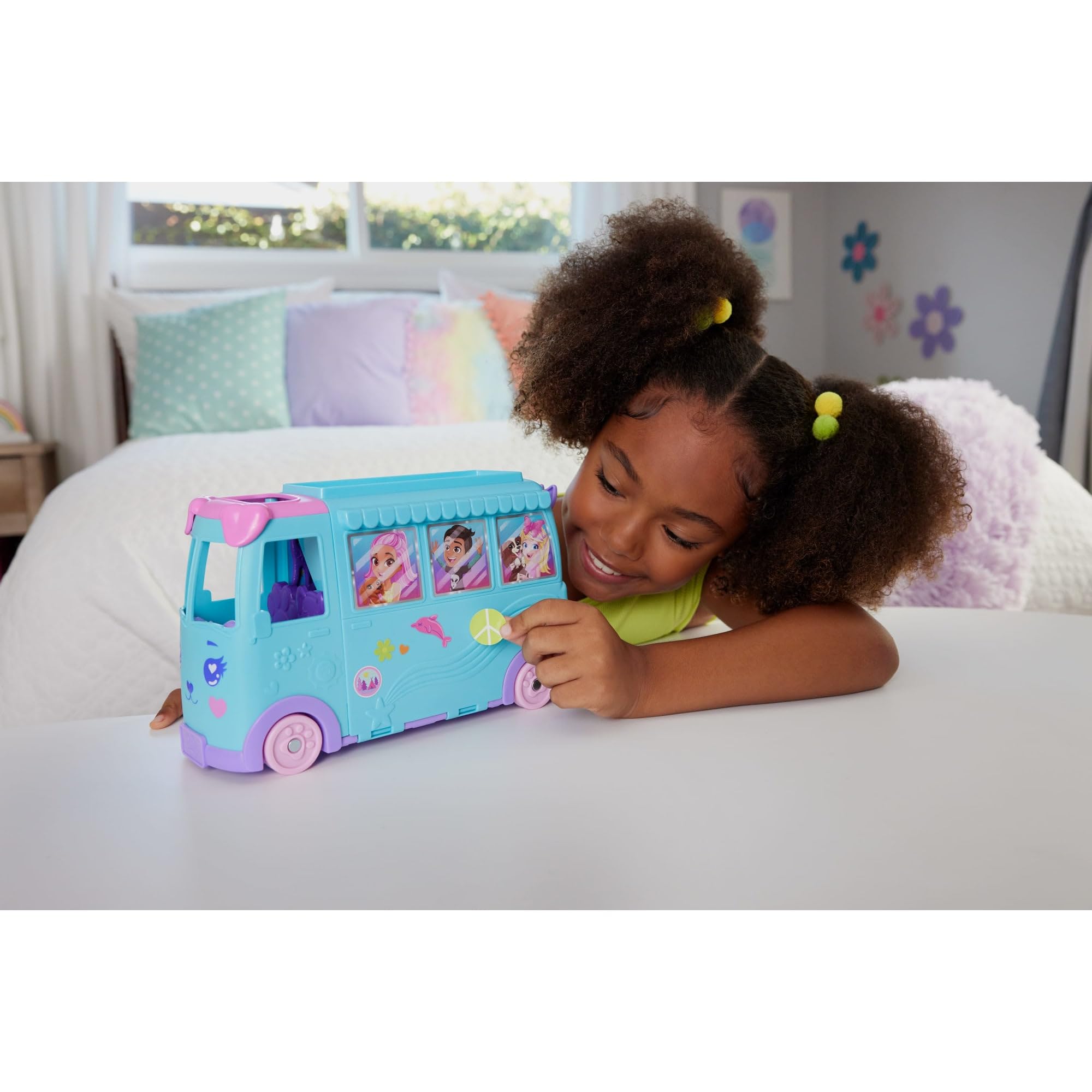 Polly Pocket micro dolls inside the transforming van for storytelling on the go.