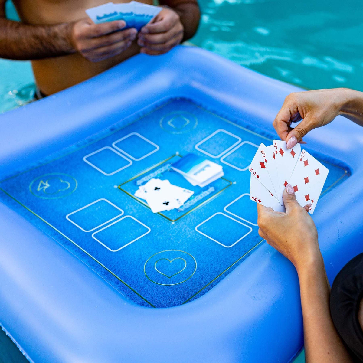 Poolcandy floating game table with waterproof cards for poolside play.
