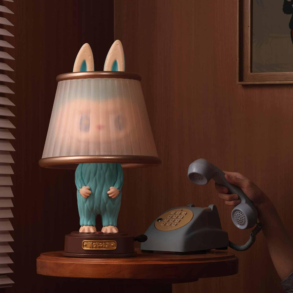 POP MART Almost Hidden Series character on desk, adds playful charm to any space.