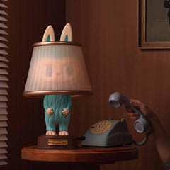 POP MART Almost Hidden Series character on desk, adds playful charm to any space.