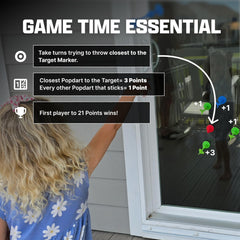 Popdarts target marker adhered to glass demonstrating precise aiming benefit