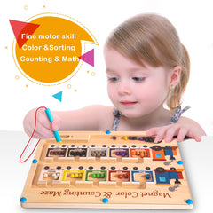 Poycuna Magnetic Pen in Action guiding beads along the path for motor precision.
